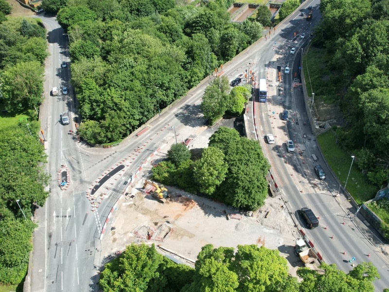 Cones in place to guide traffic around the new layout connecting the A629 to the A6026. Construction equipment works in the area where the now closed Wakefield Road link used to be. 